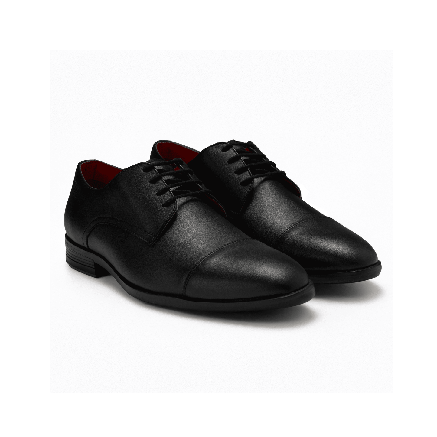 Pair of black dress shoes on a white background
