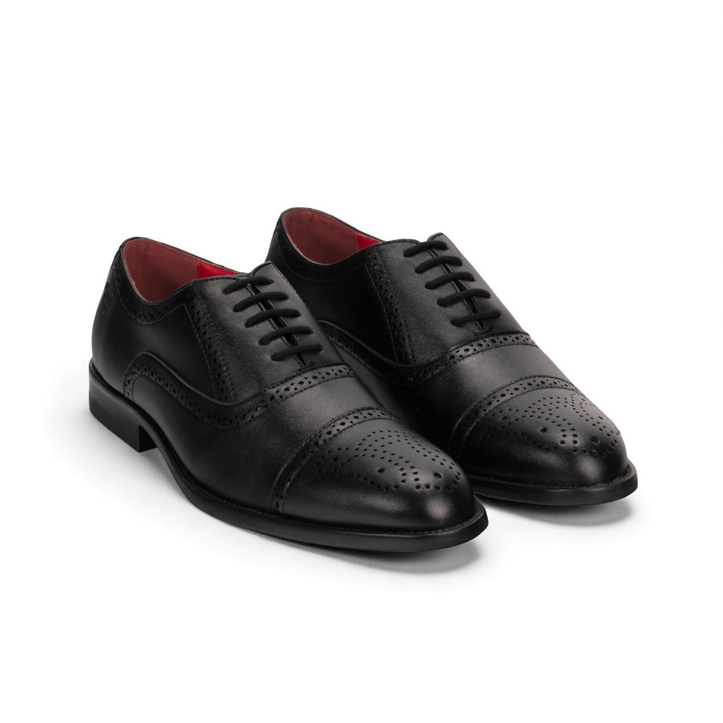 Pair of black dress shoes with red lining on a white background