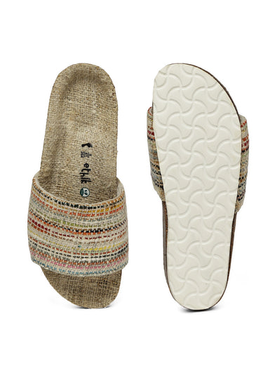 Slipper with patterned sole and white interior sole on a white background