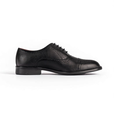 Black leather dress shoe on a white background