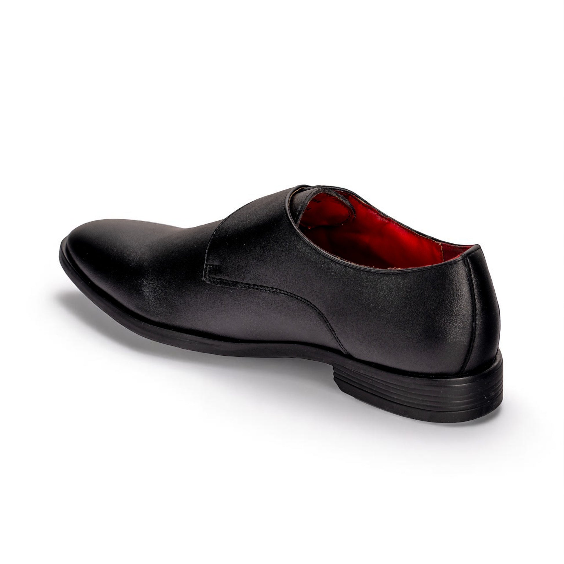 Black dress shoe with red lining on a white background