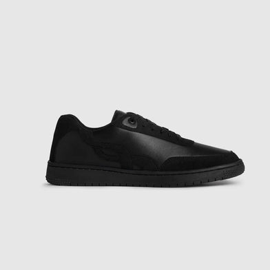 Black sneaker on a light gray background