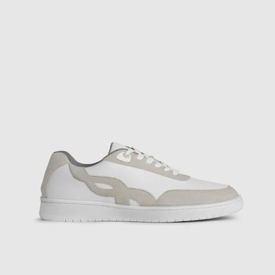 White sneaker with gray accents on a light gray background