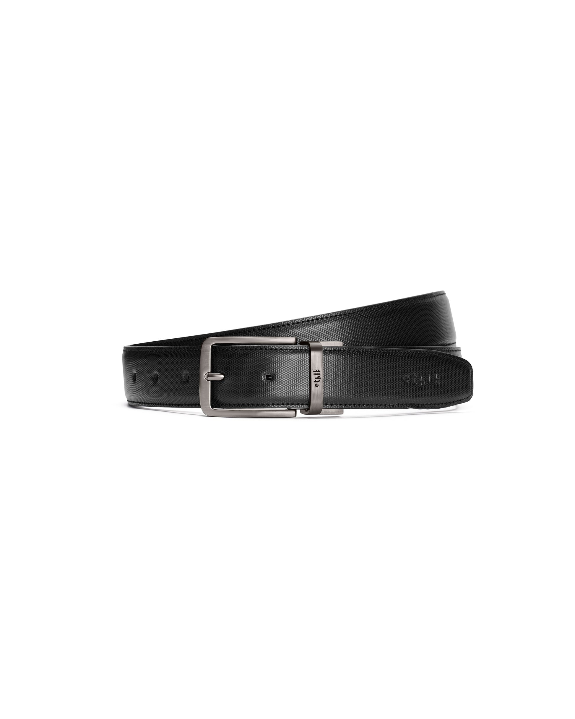 Black leather belt with a silver buckle on a white background