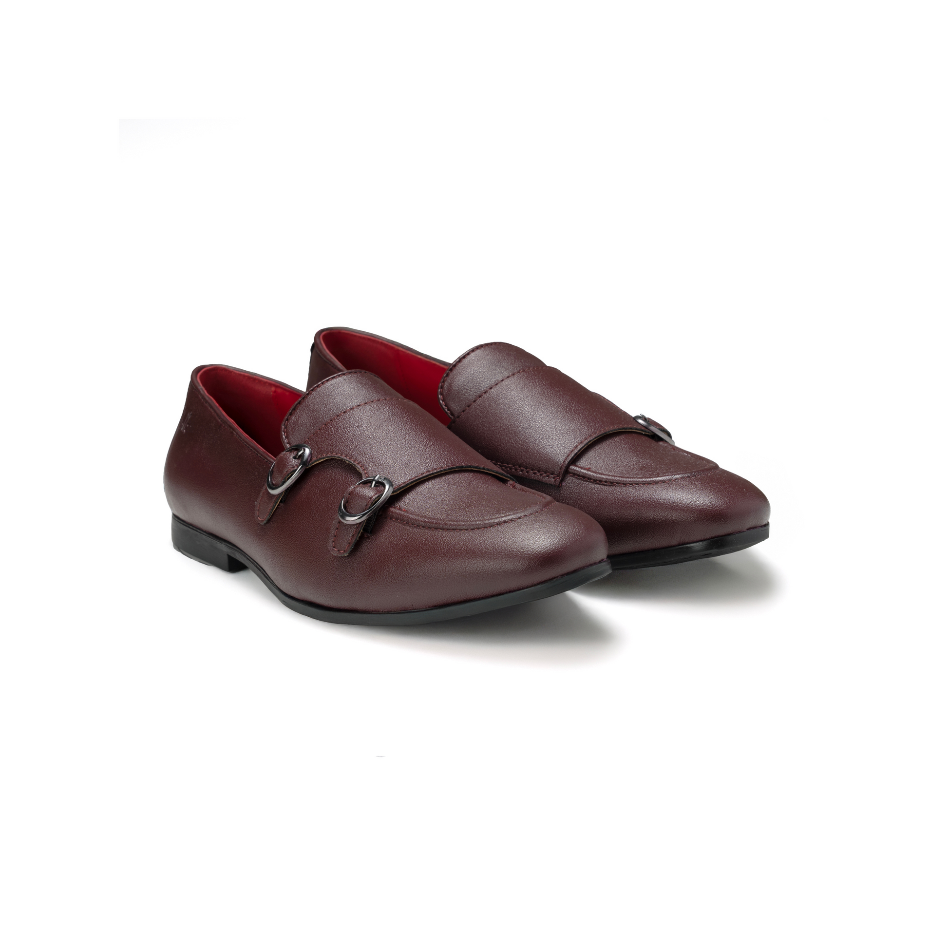 Pair of maroon loafers with a red interior on a white background
