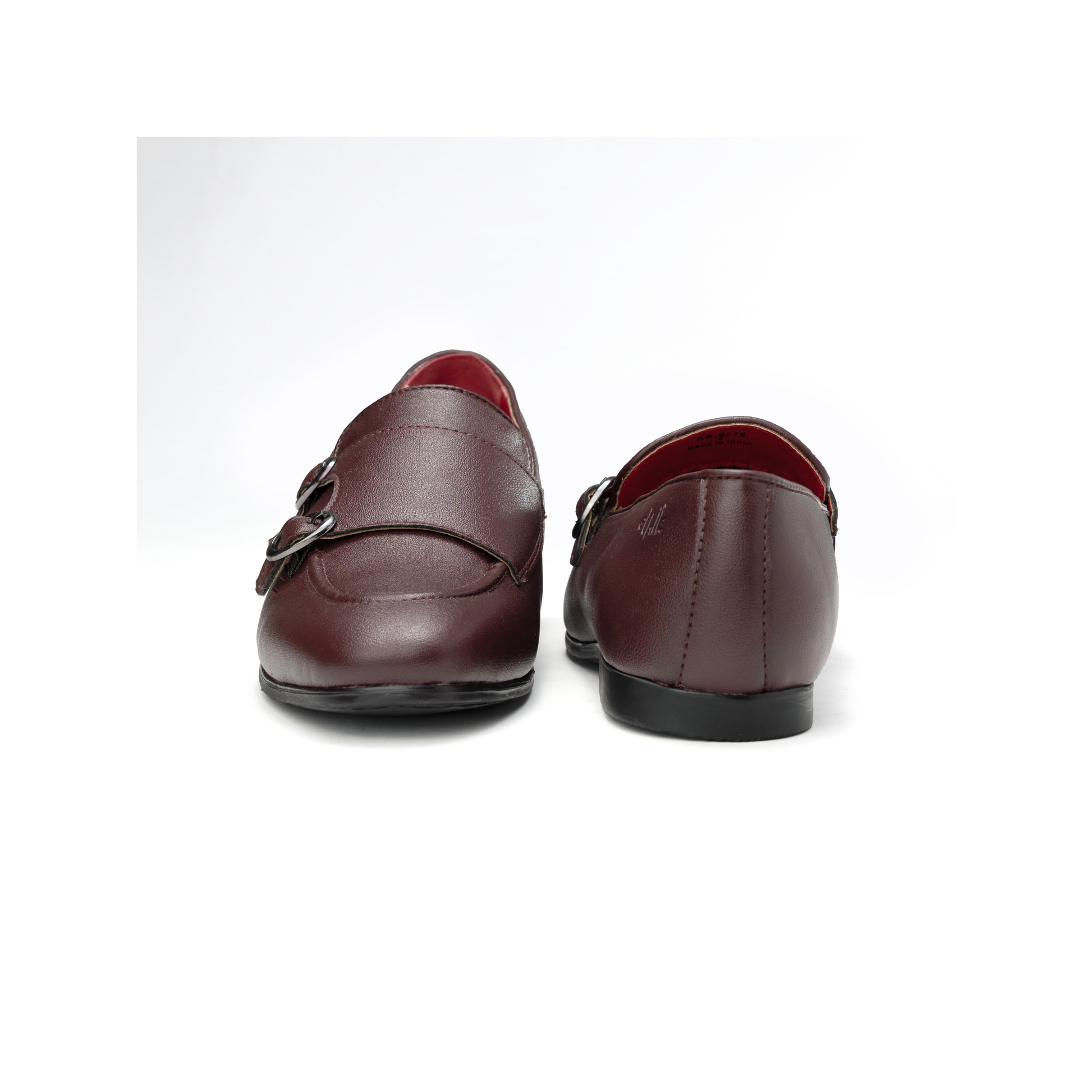 Pair of brown leather loafers on a white background