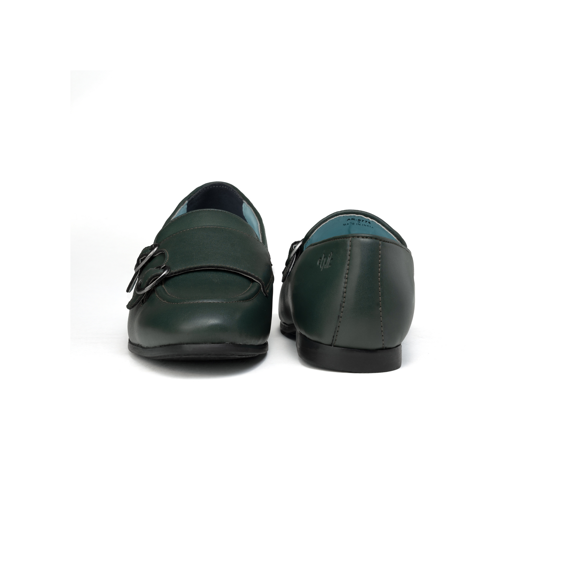 Pair of green loafers on a white background