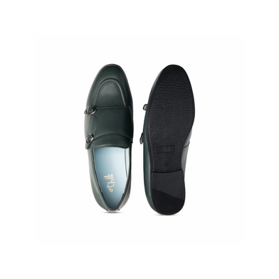 Black loafers shown from top and bottom on a white background
