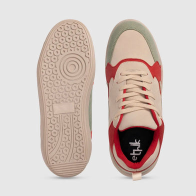 Red and beige sneaker with 'etik' branding on a light gray background