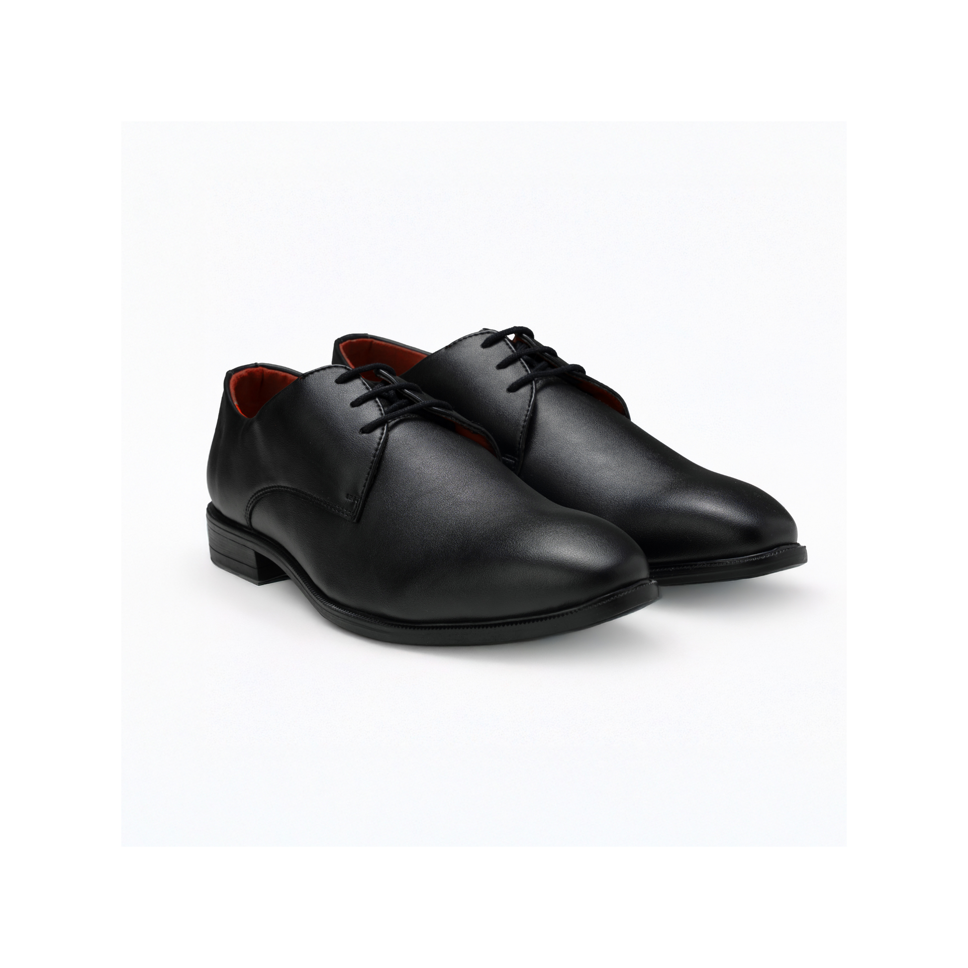 Pair of black dress shoes on a white background
