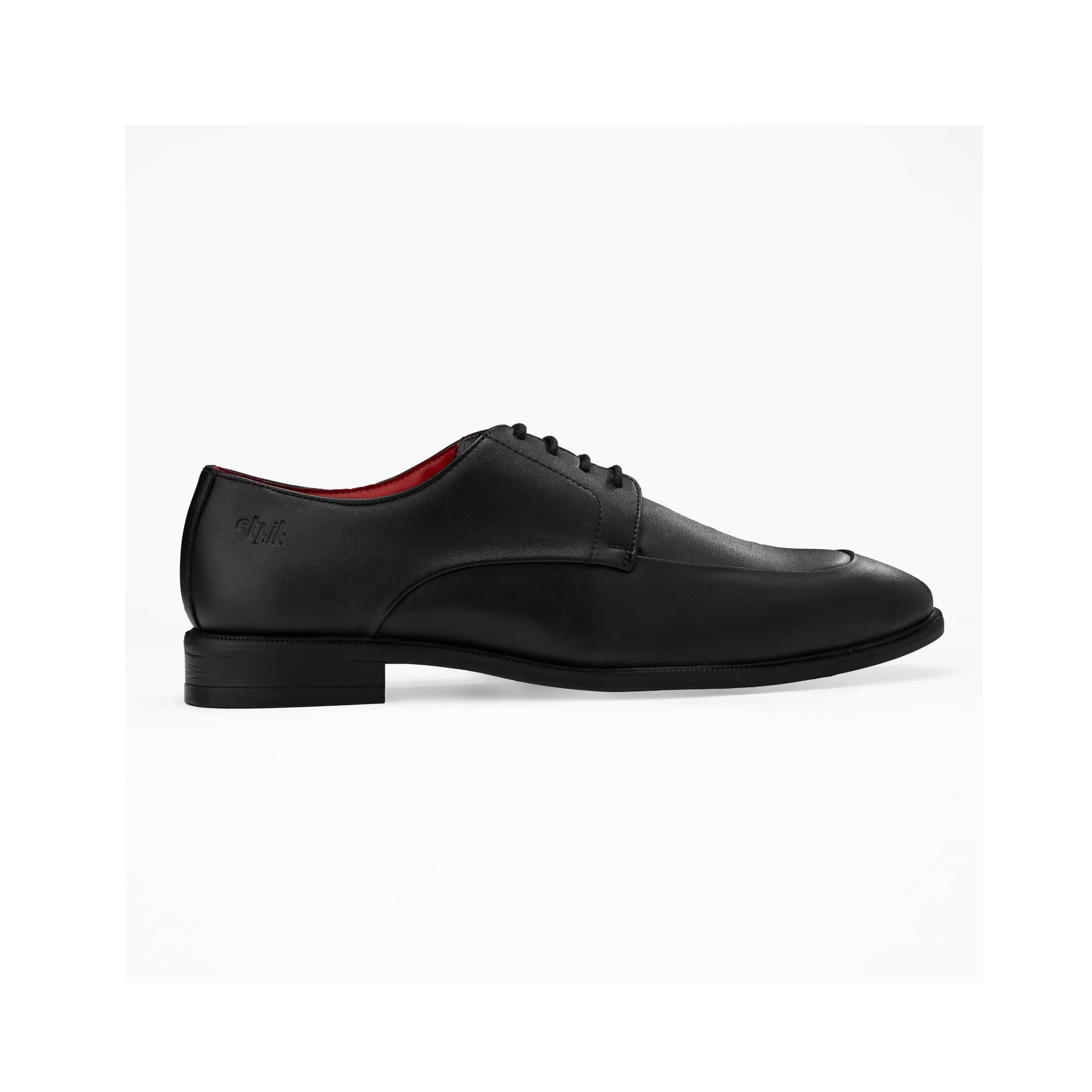 Black leather dress shoe on a white background