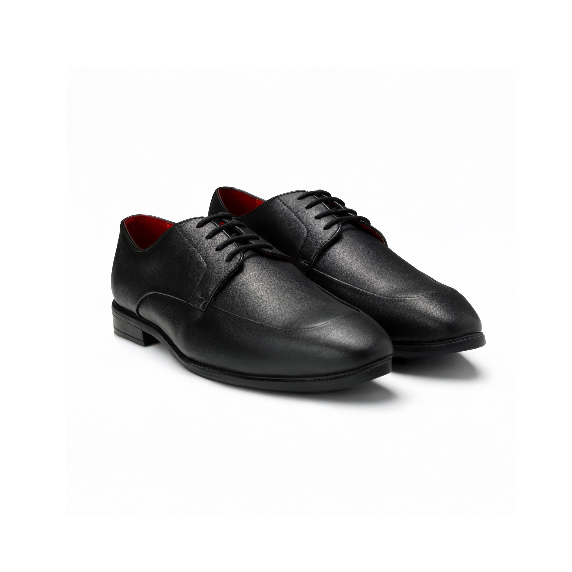 Pair of black dress shoes with red lining on a white background