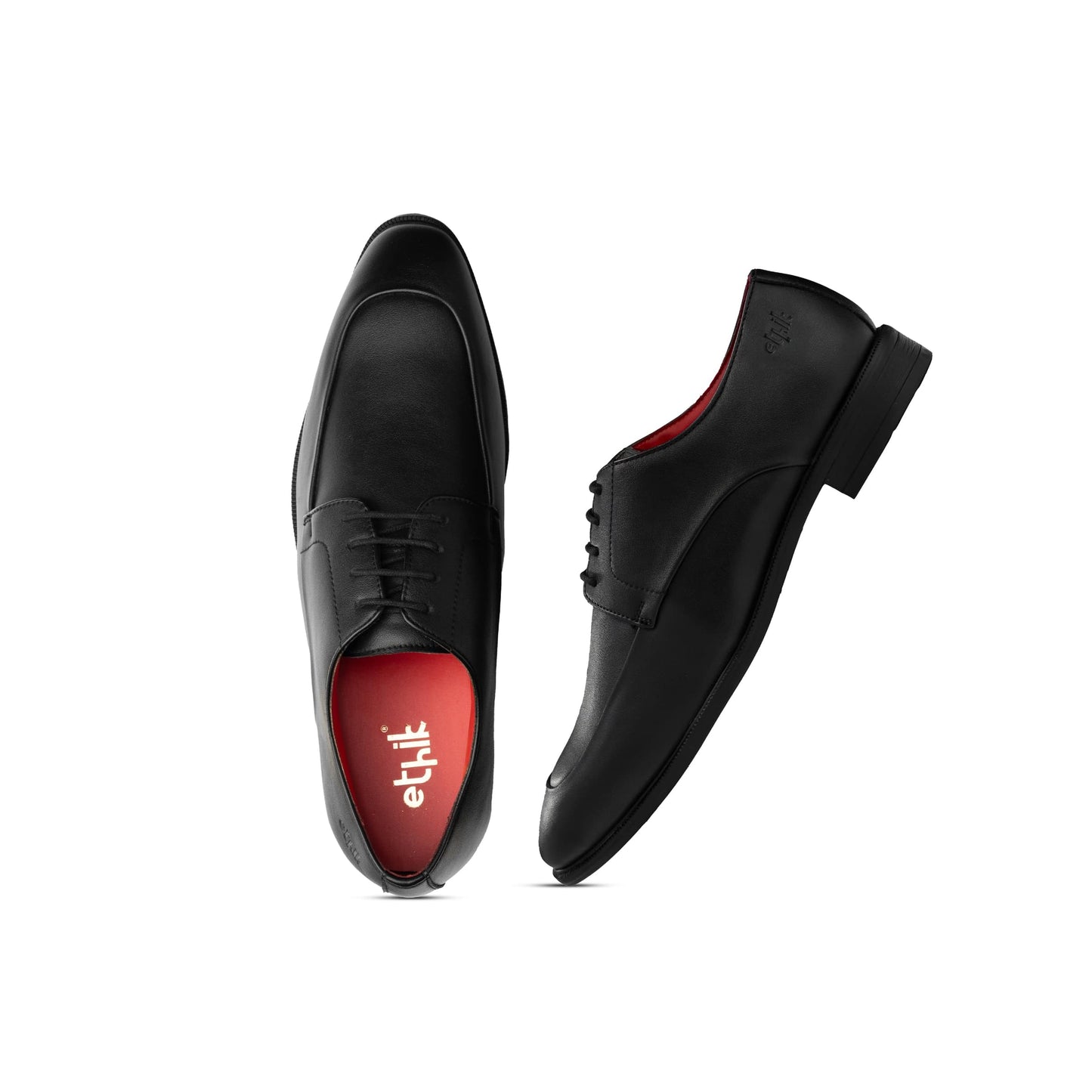 Black dress shoes with red soles on a white background