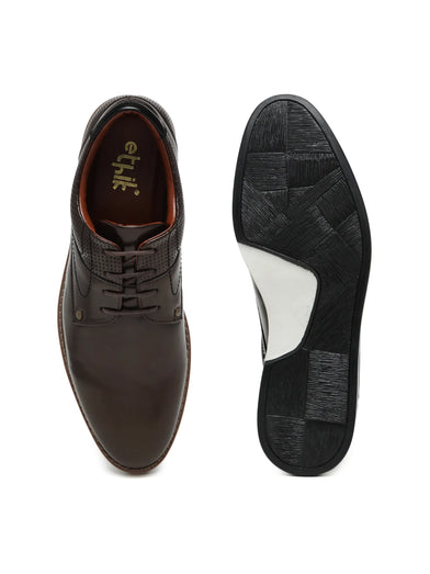 Brown leather shoe with black sole on a white background