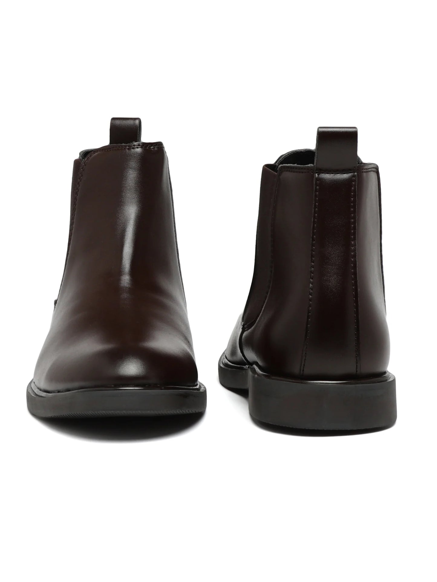 Pair of dark brown leather boots on a white background