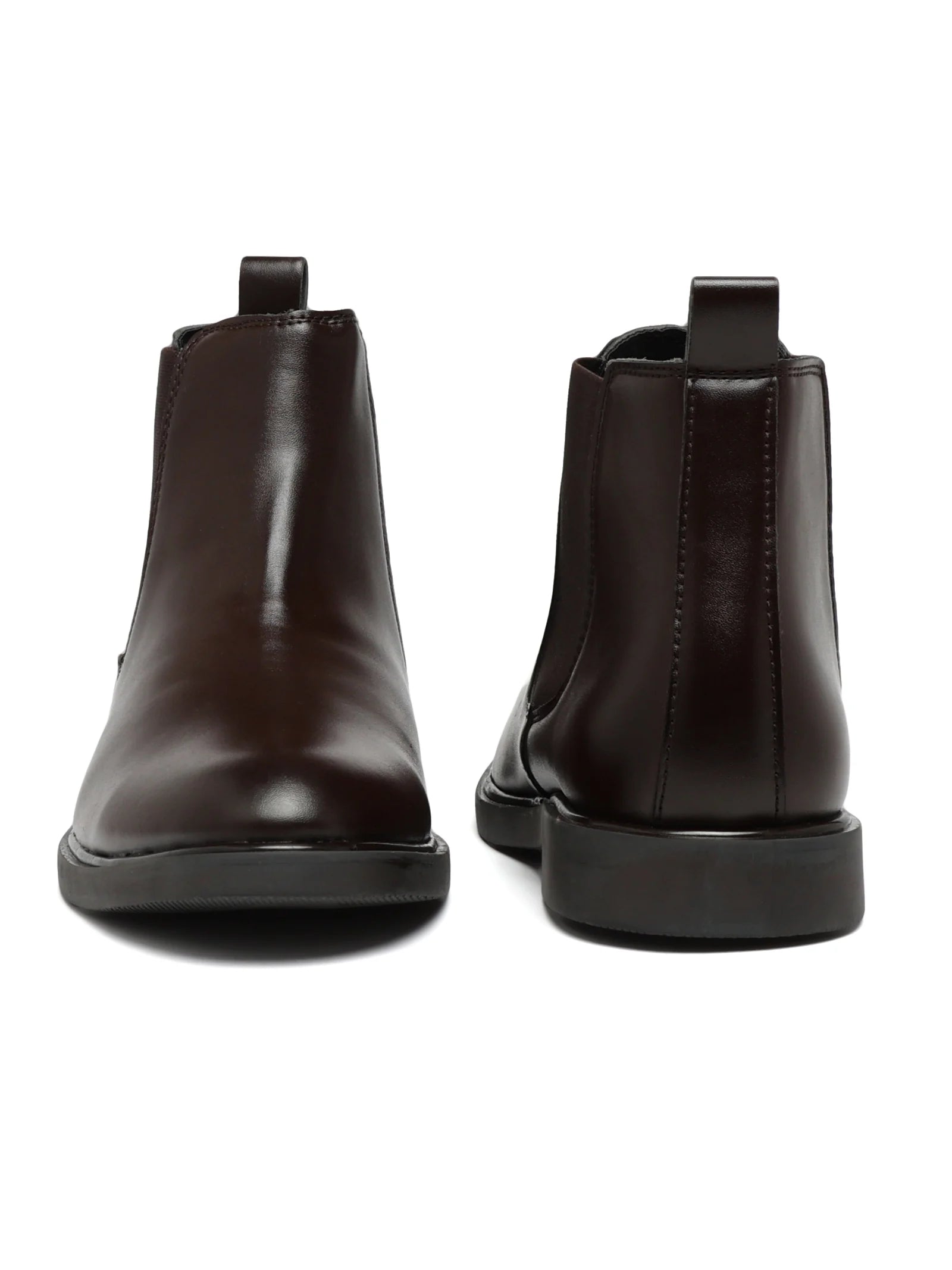Pair of dark brown leather boots on a white background