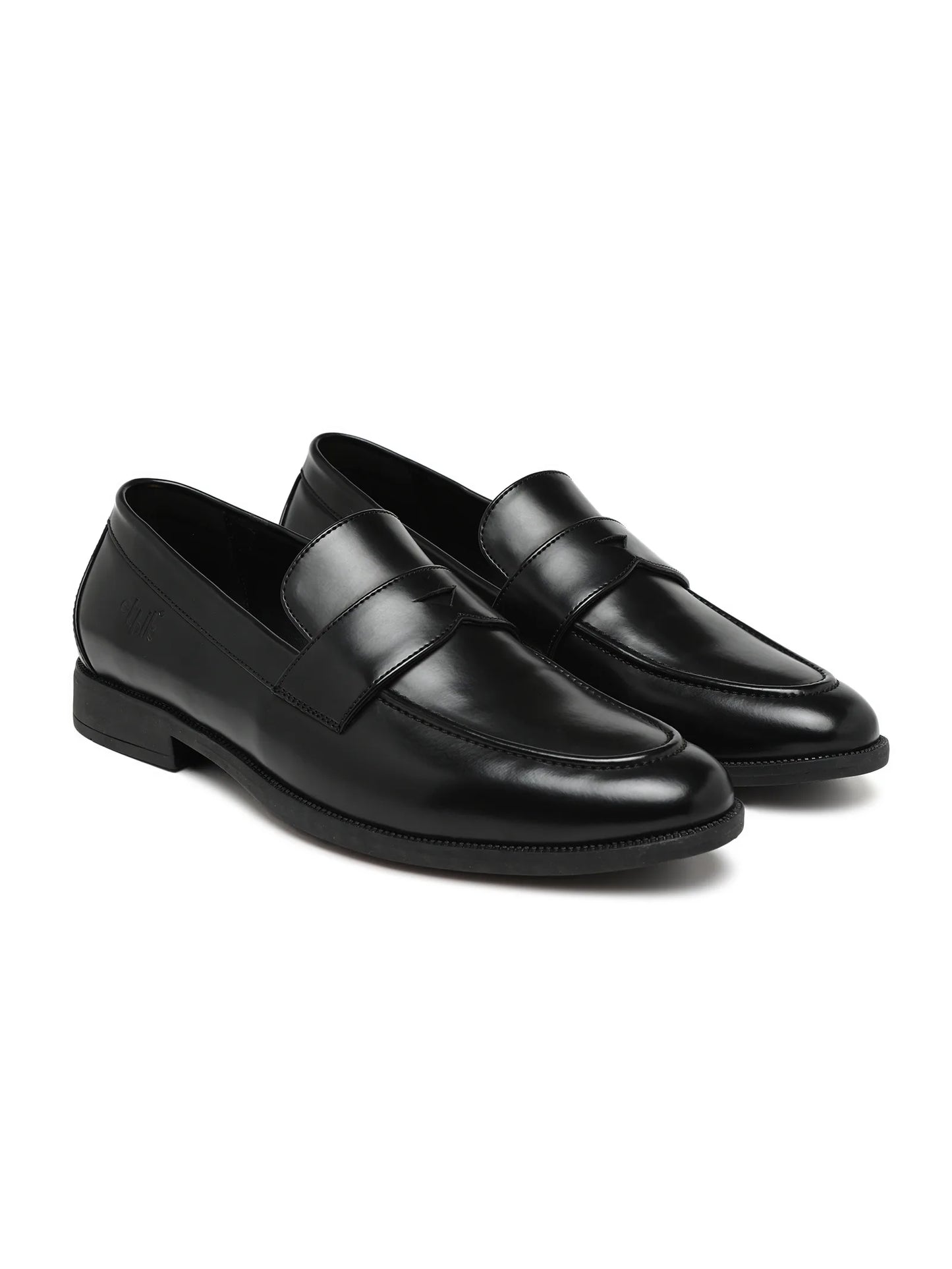 Pair of black loafers on a white background