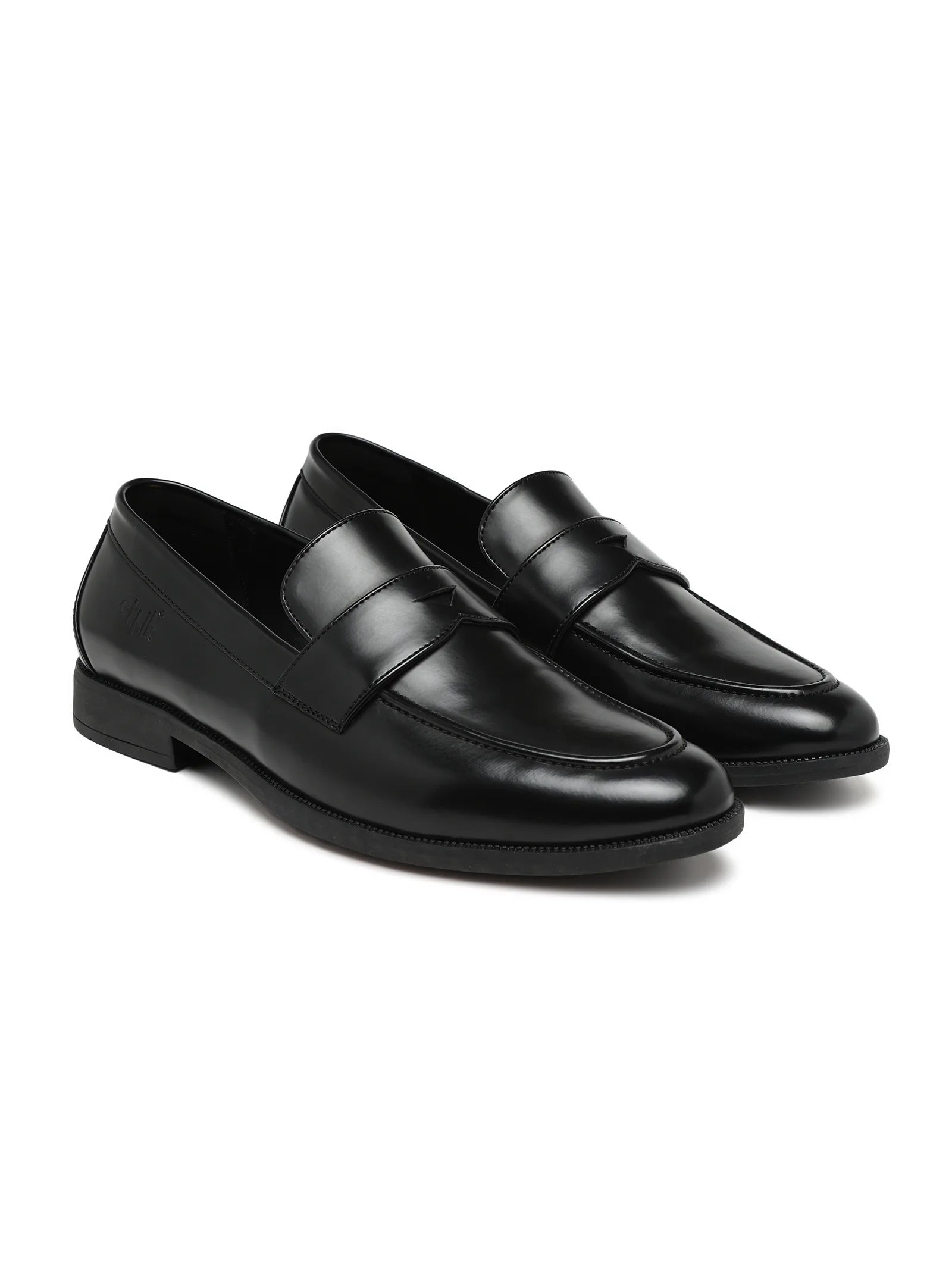 Pair of black loafers on a white background