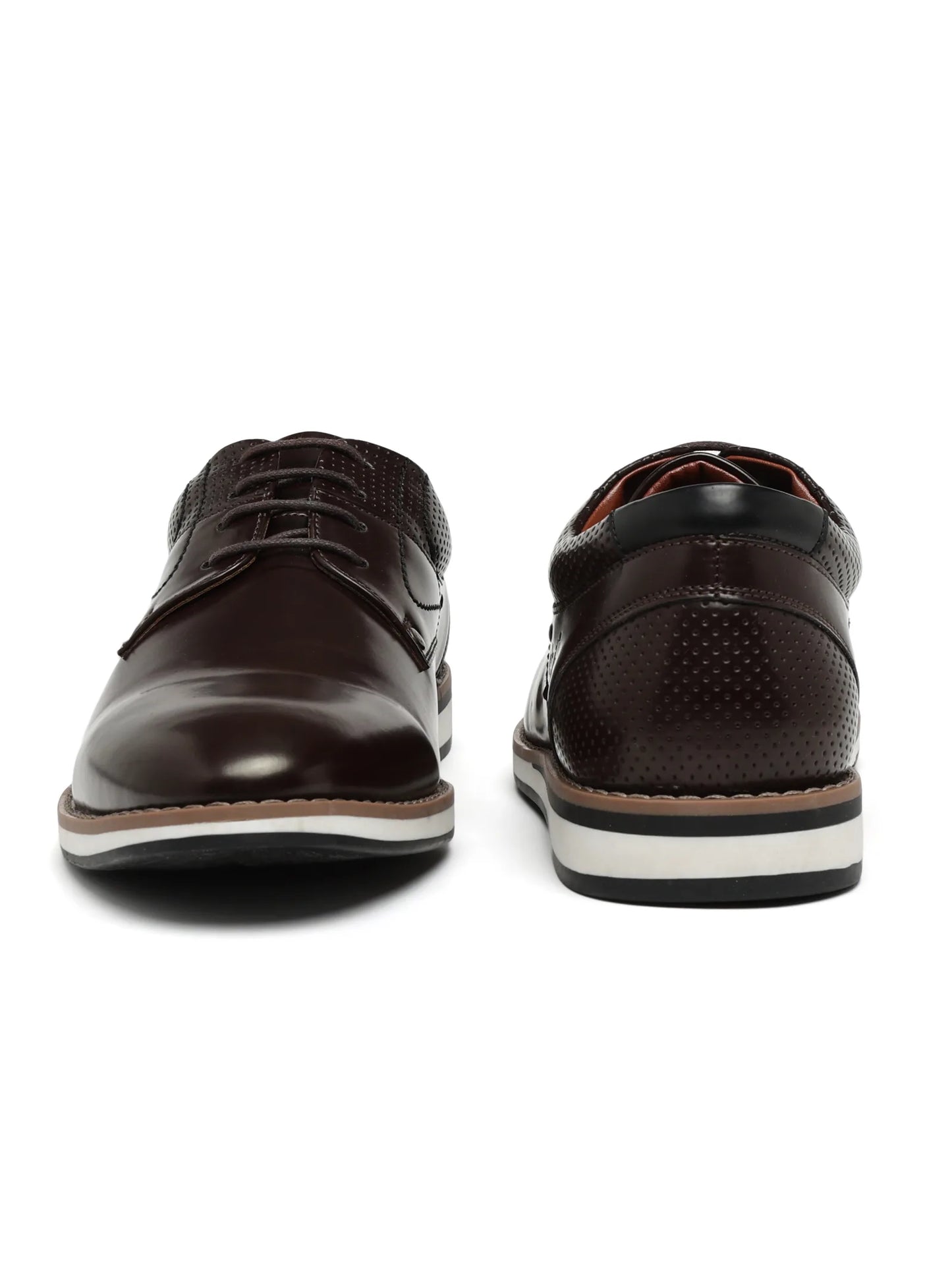 Pair of brown leather shoes on a white background