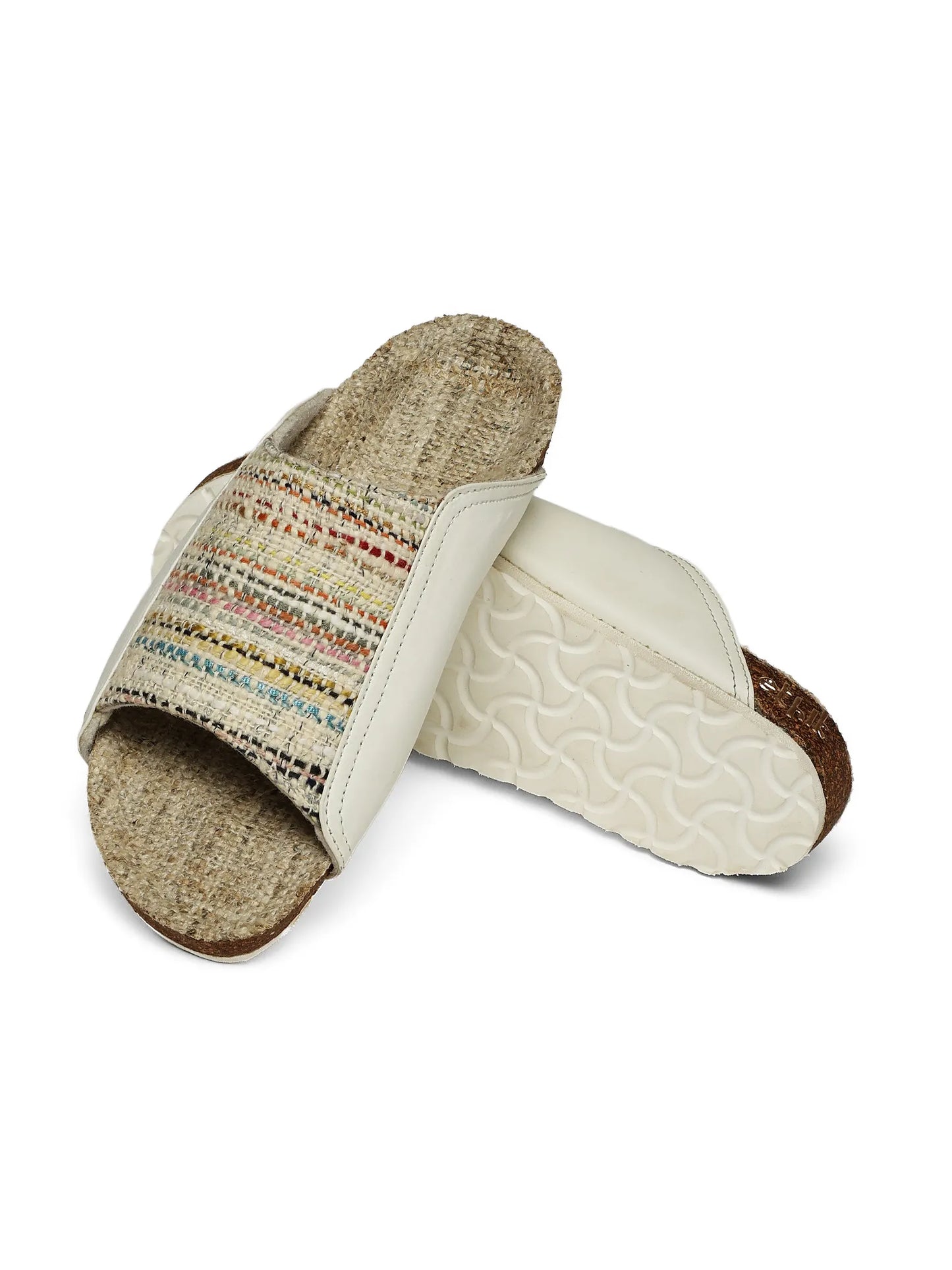 Pair of slippers with woven design on a white background