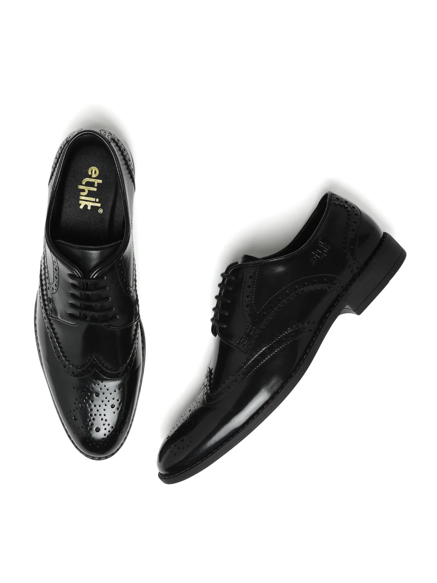 Black dress shoes with 'etik' branding on a white background