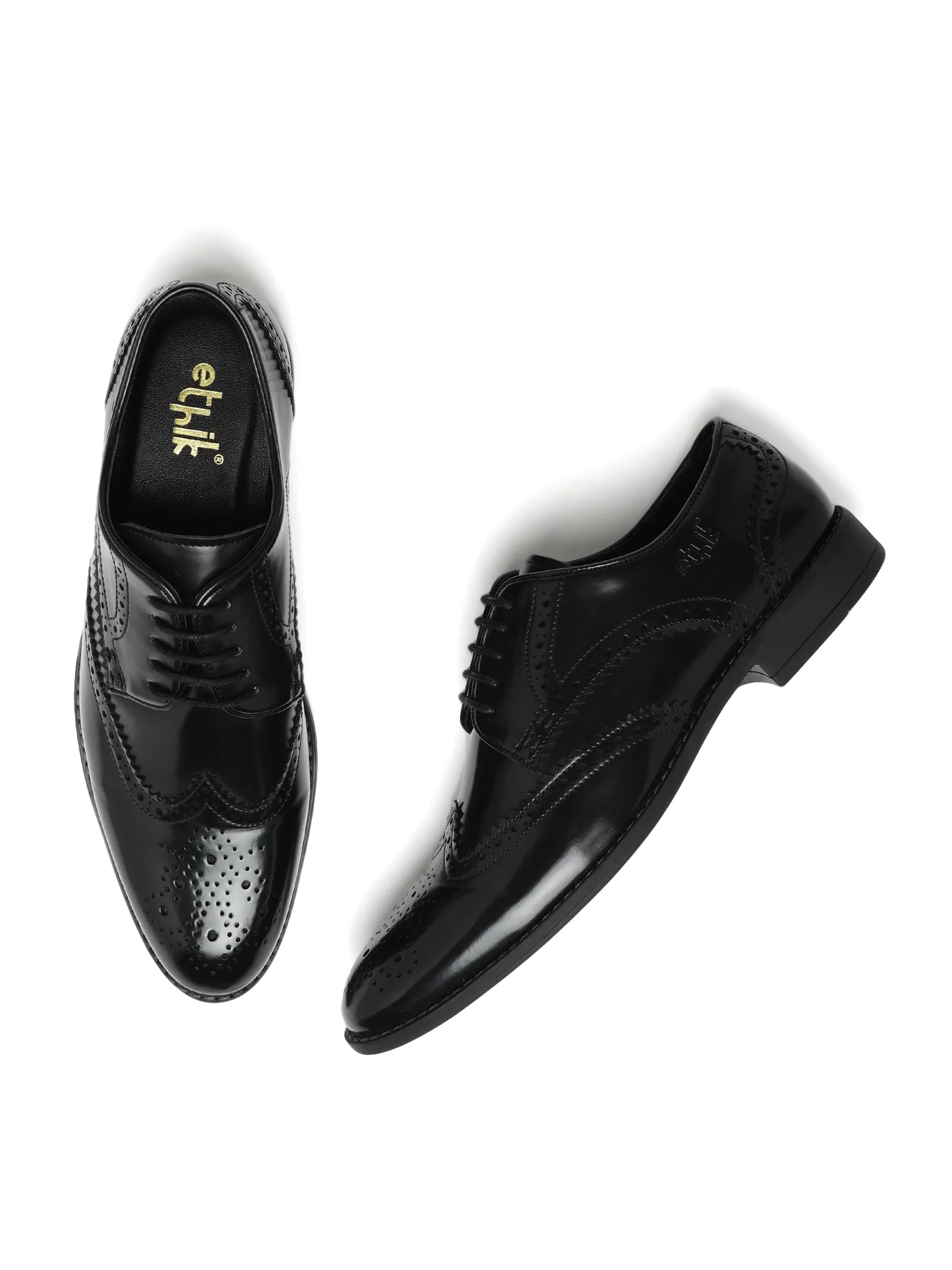 Black dress shoes with 'etik' branding on a white background