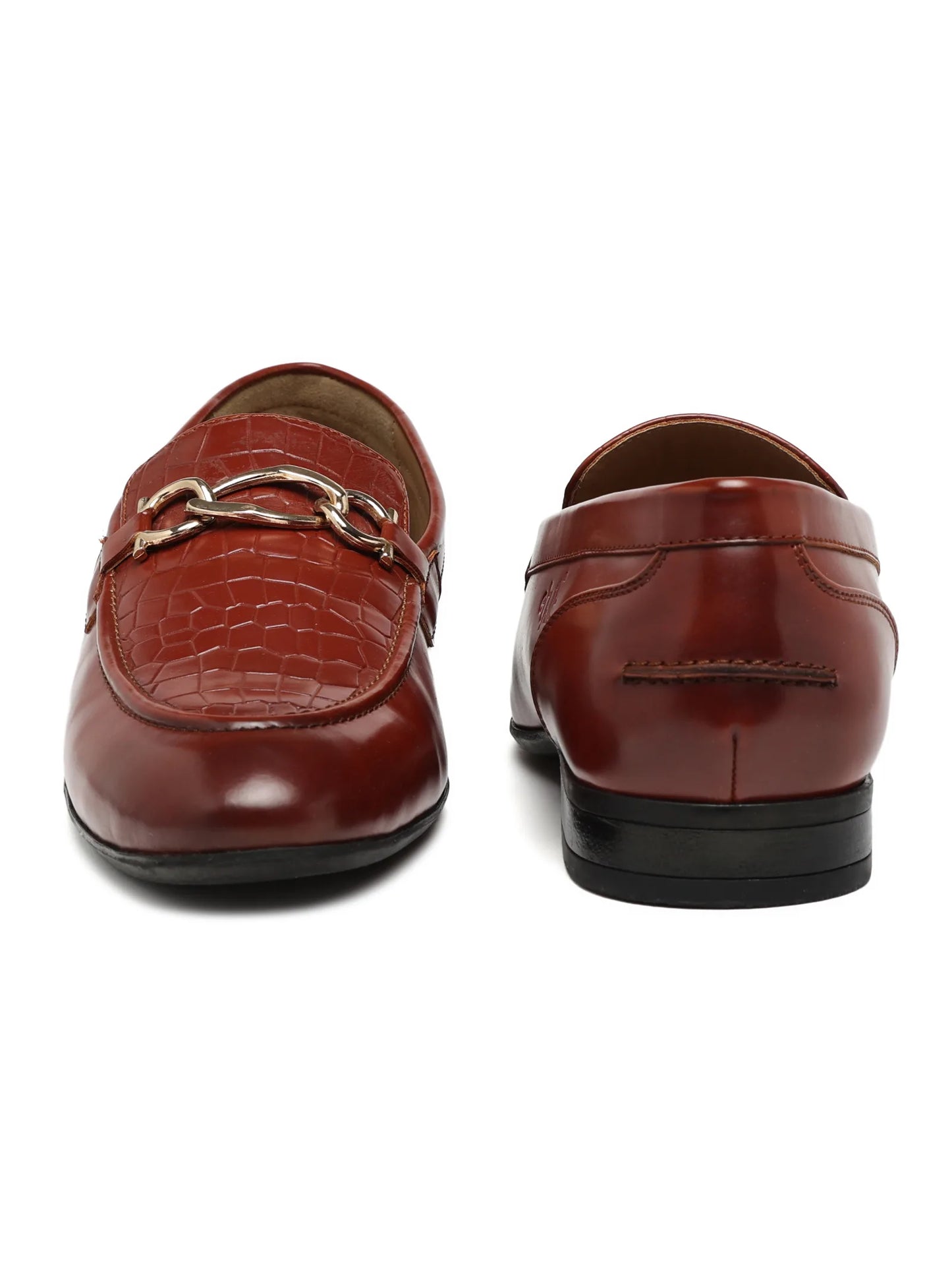 Pair of brown leather loafers on a white background