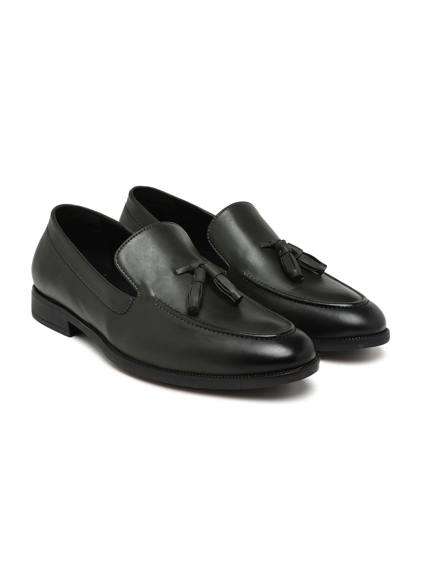 Black loafers with tassels on a white background