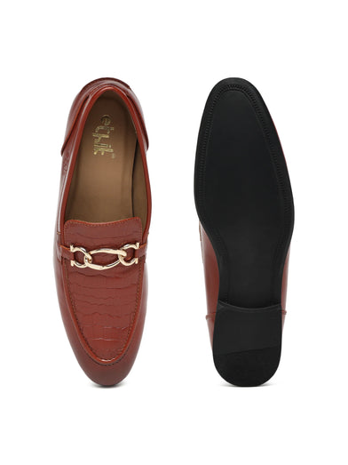 Brown loafer shoe with a gold chain detail on a white background