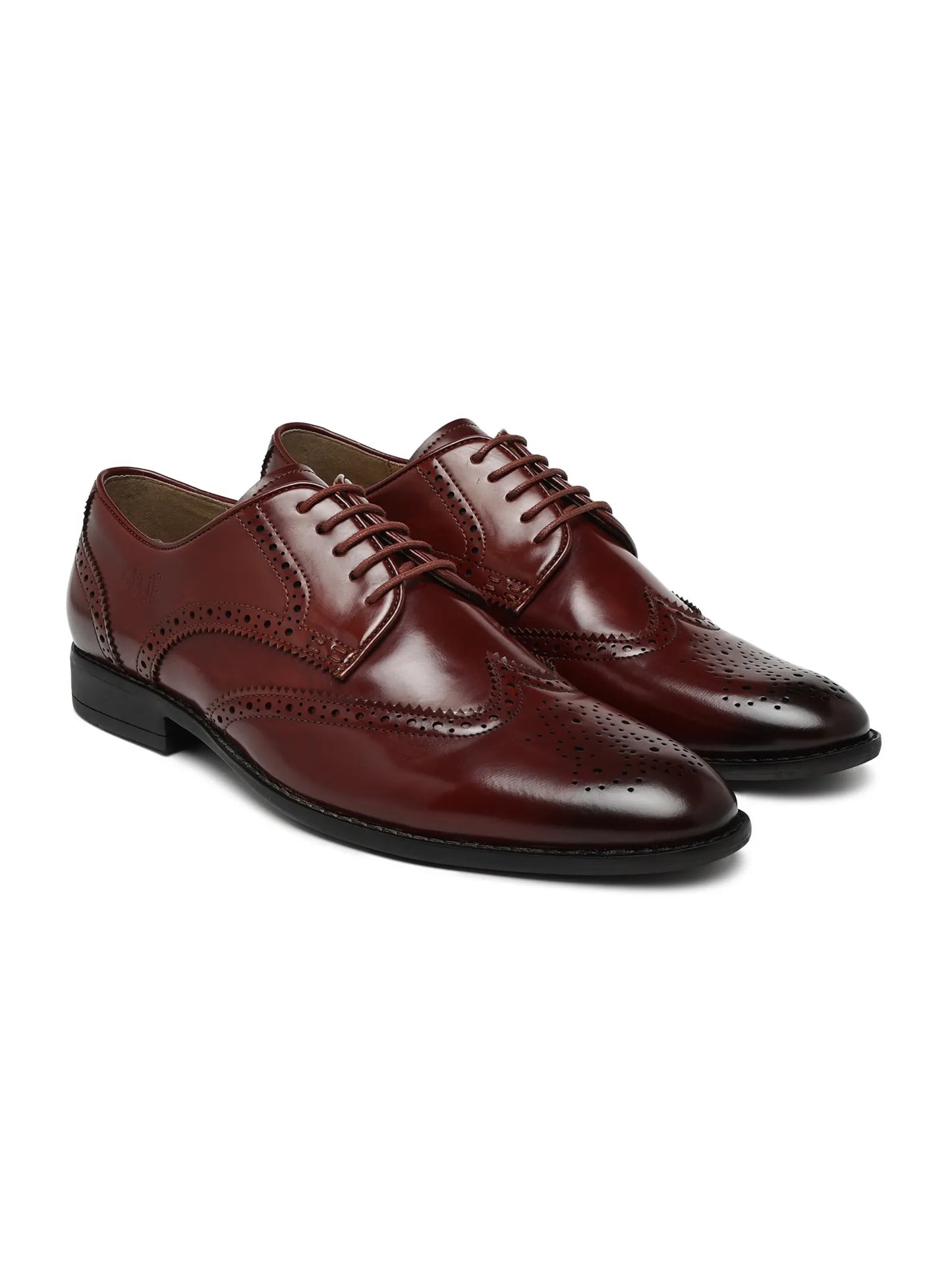 Pair of brown leather dress shoes on a white background