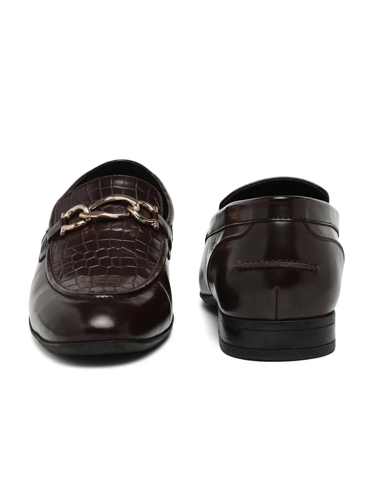 Pair of brown loafers with gold chain detail on a white background