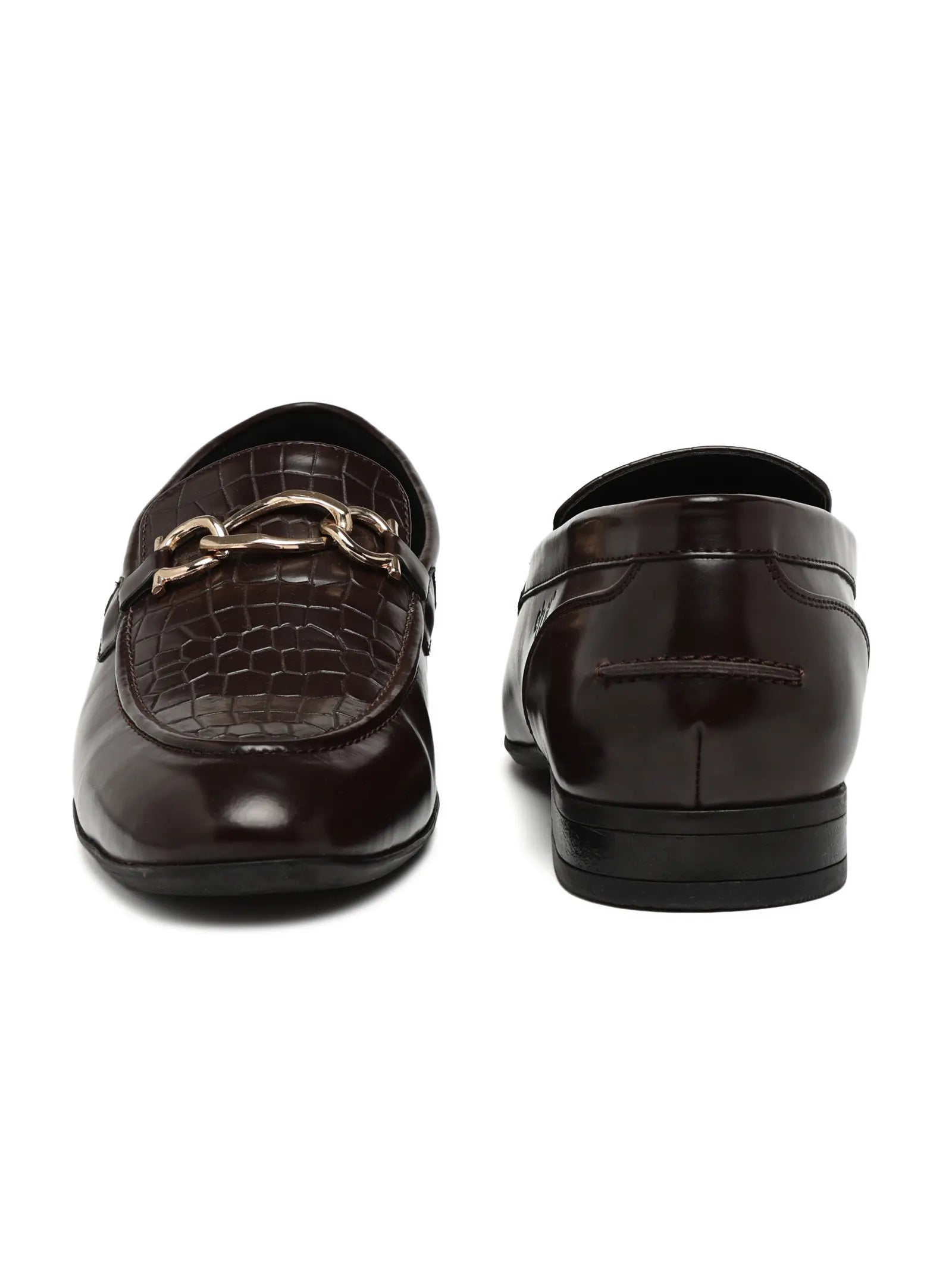 Pair of brown loafers with gold chain detail on a white background