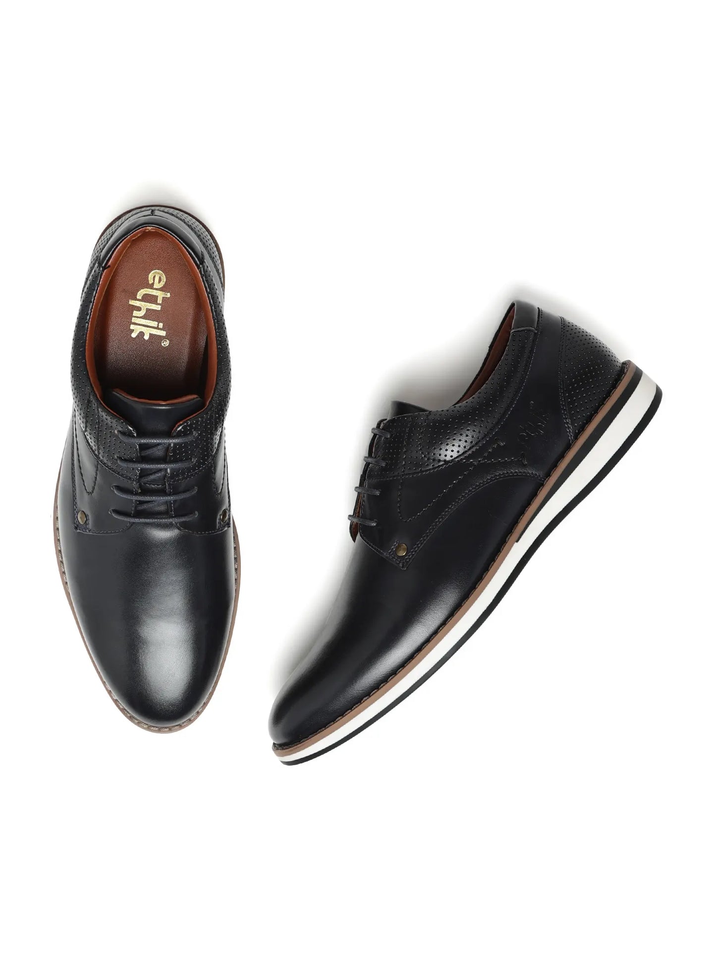 Pair of black leather shoes on a white background