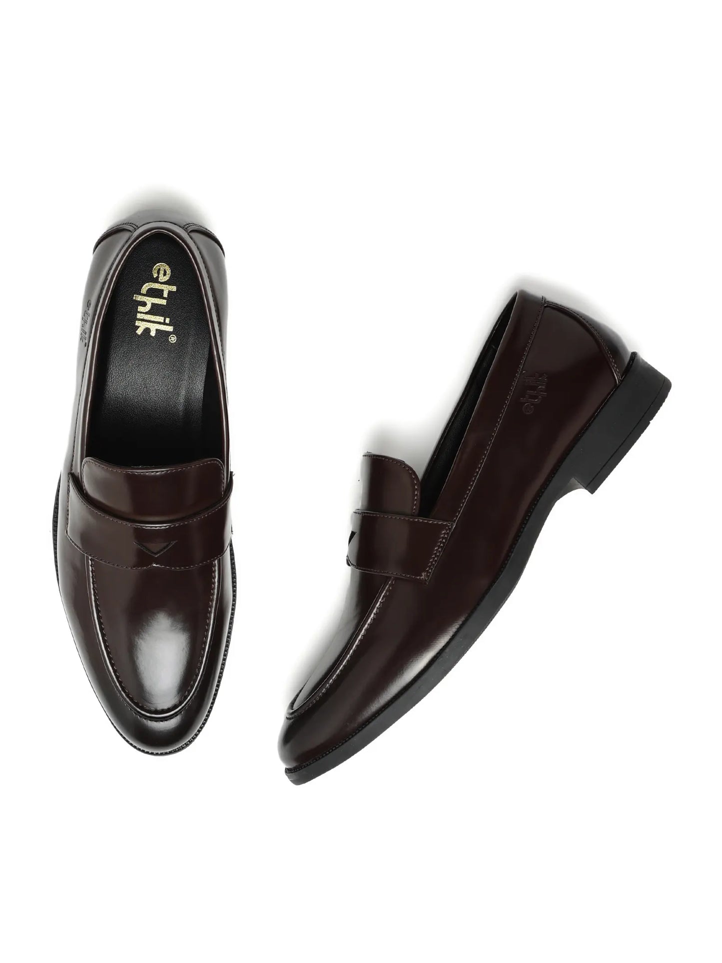 Pair of brown loafers on a white background
