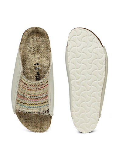 Two shoe insoles, one with a textured pattern and the other with a white sole, on a white background.