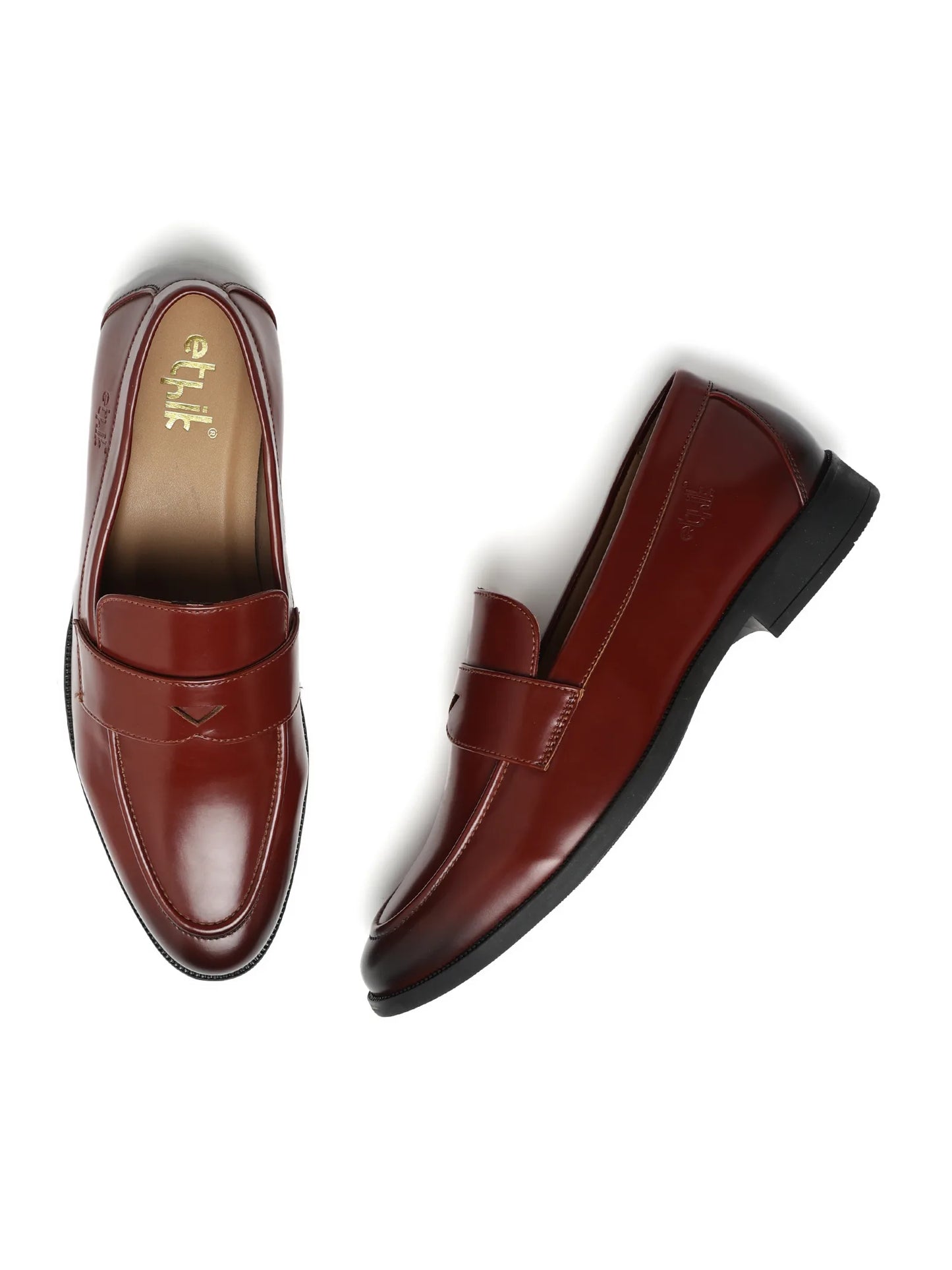 Pair of brown loafers on a white background