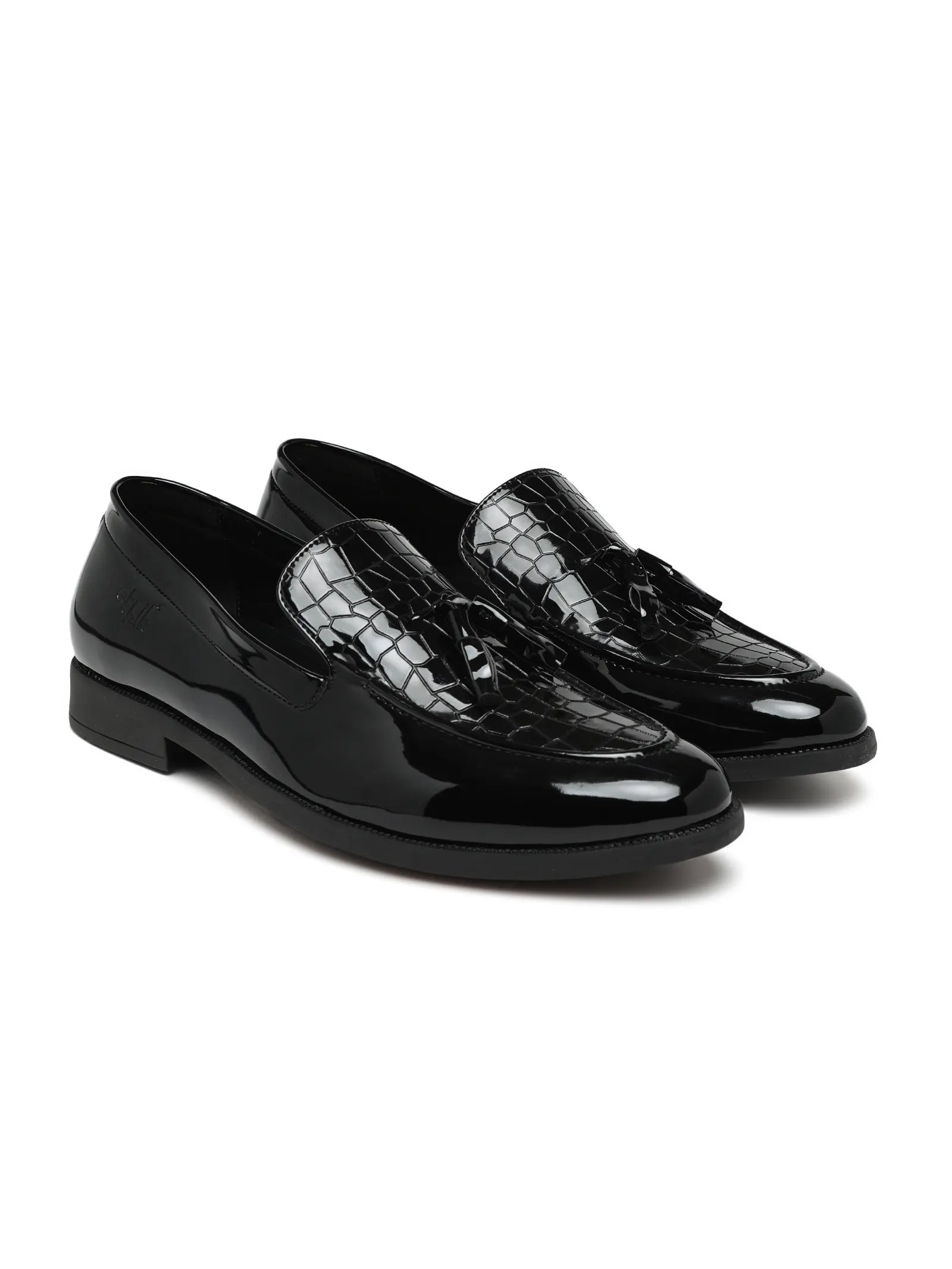 Pair of black patent leather shoes with crocodile texture on a white background