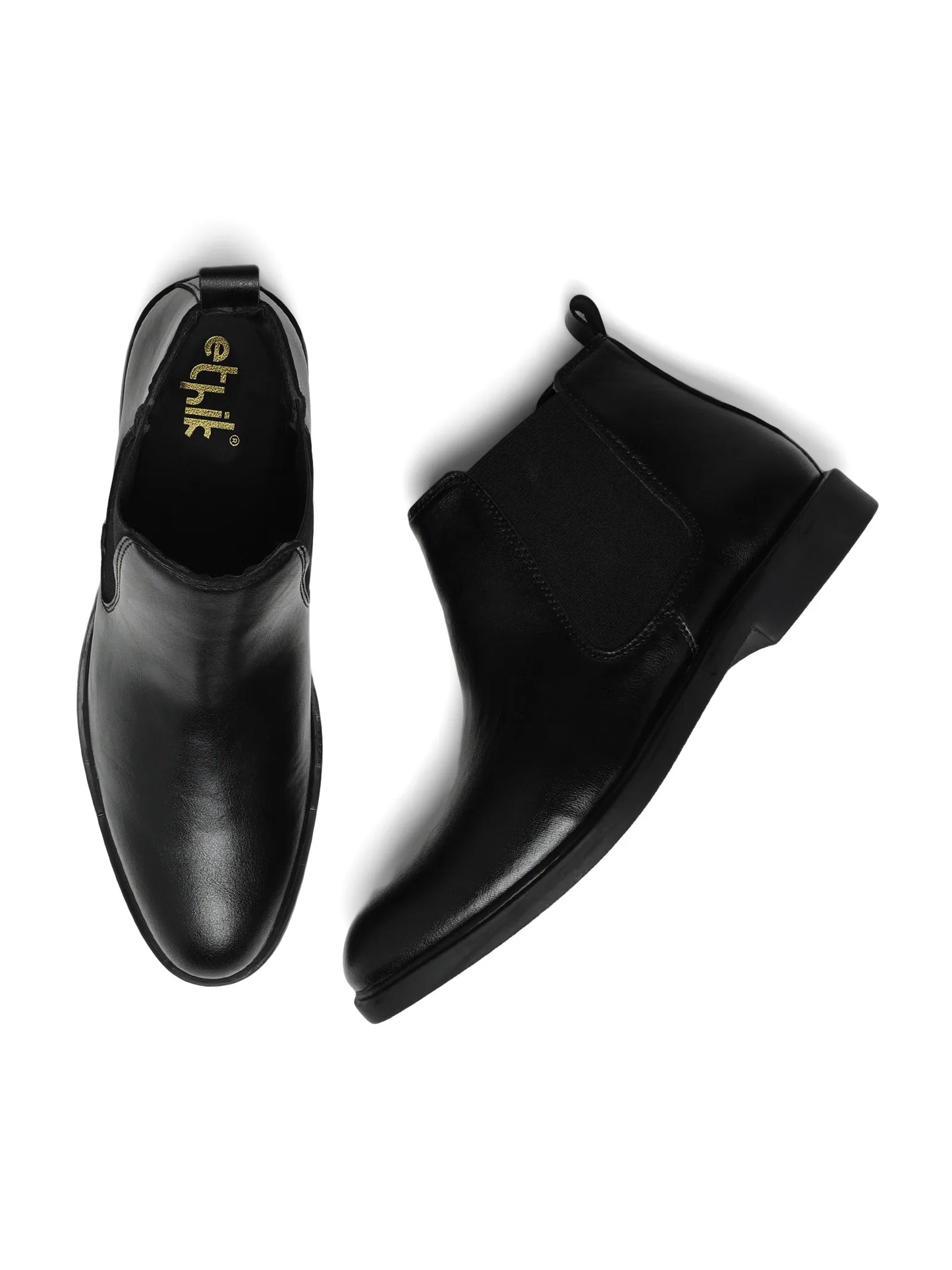 Pair of black leather boots with 'ethik' branding on a white background