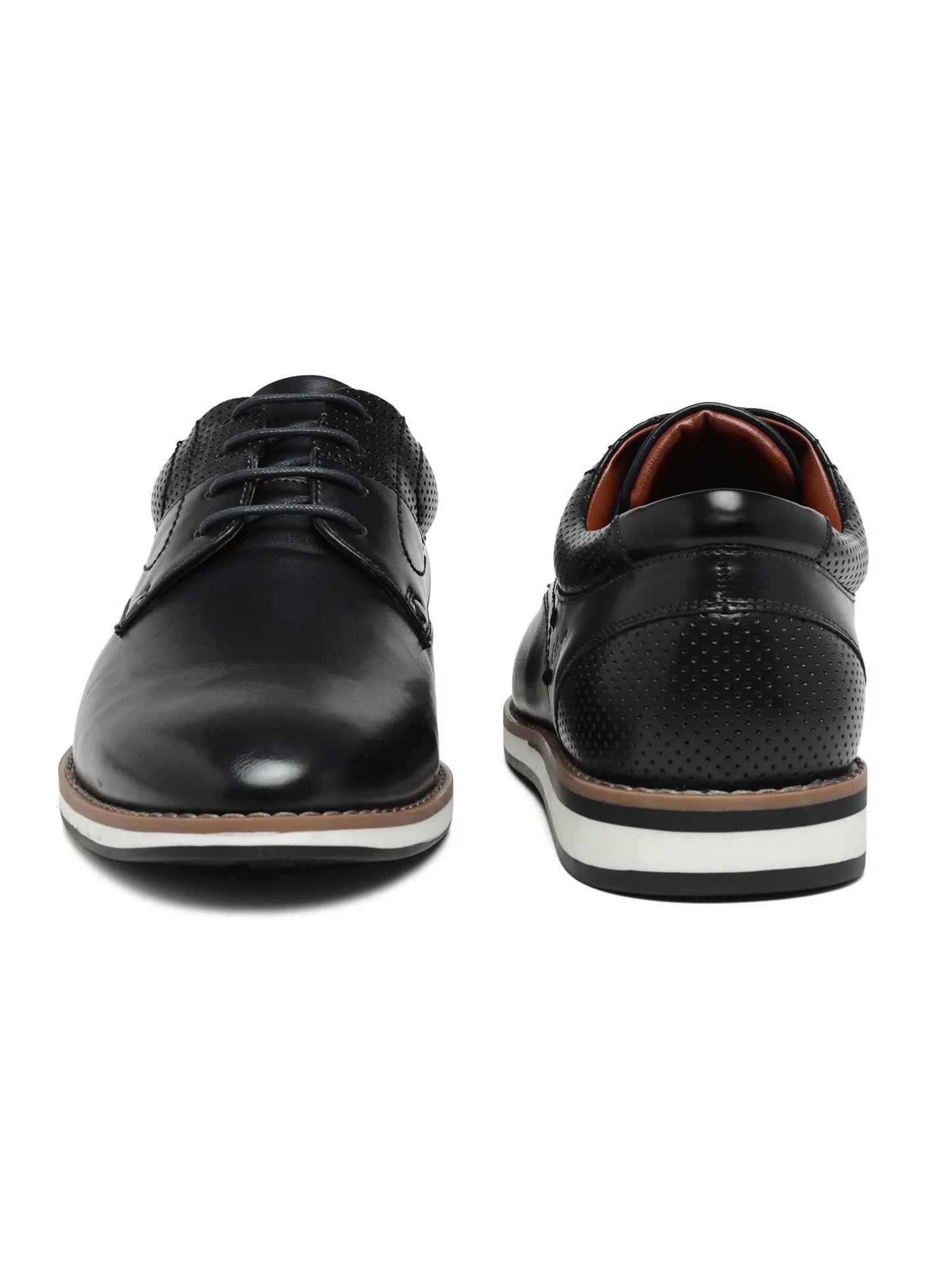Black leather shoes with white soles on a white background