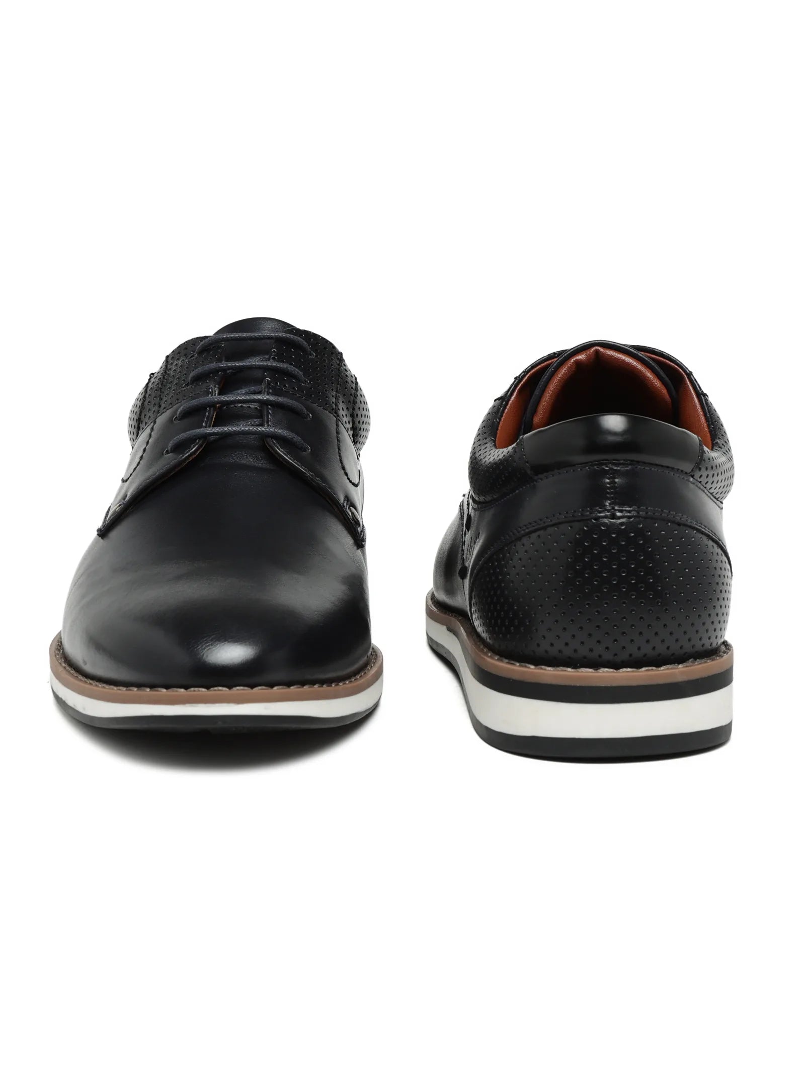 Black leather shoes with white soles on a white background