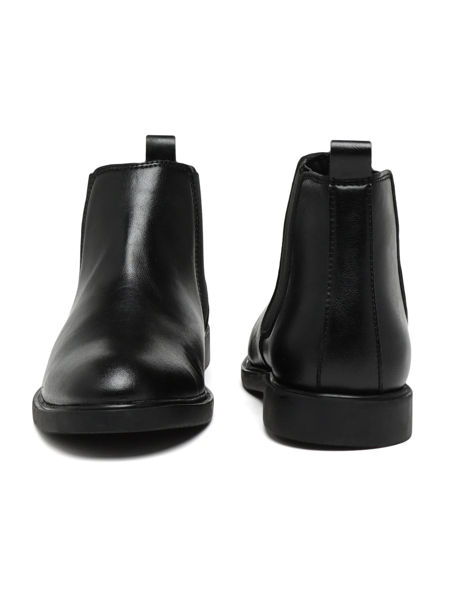 Pair of black leather Chelsea boots on a white background