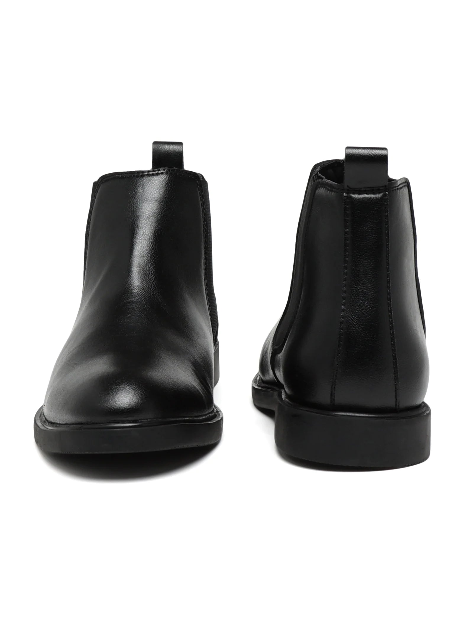 Pair of black leather Chelsea boots on a white background