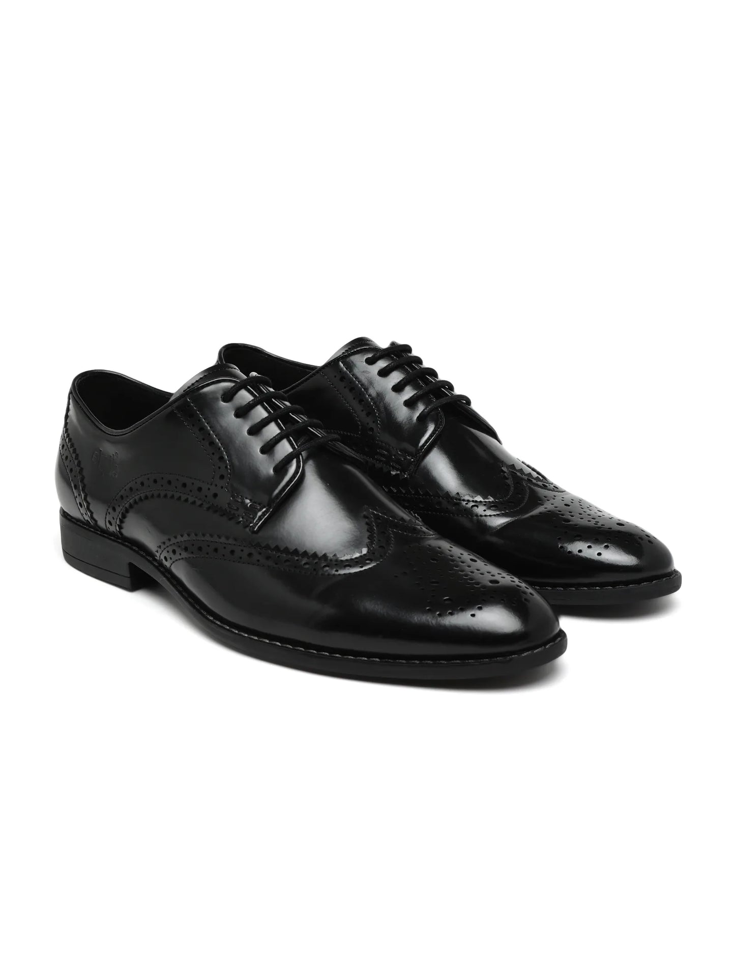 Gray suede and black leather dress shoes on a white background