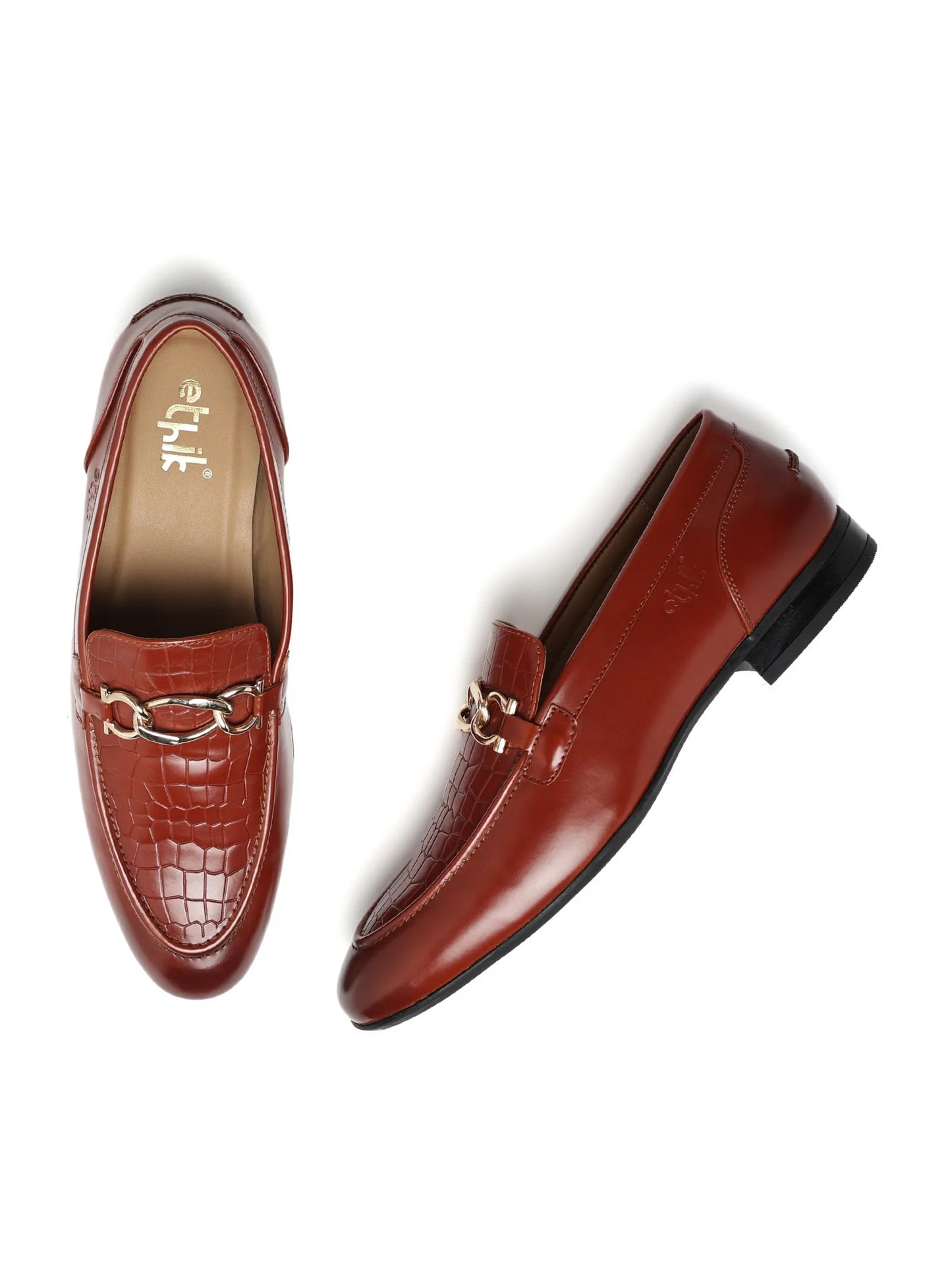 Pair of brown loafers with a gold chain detail on a white background