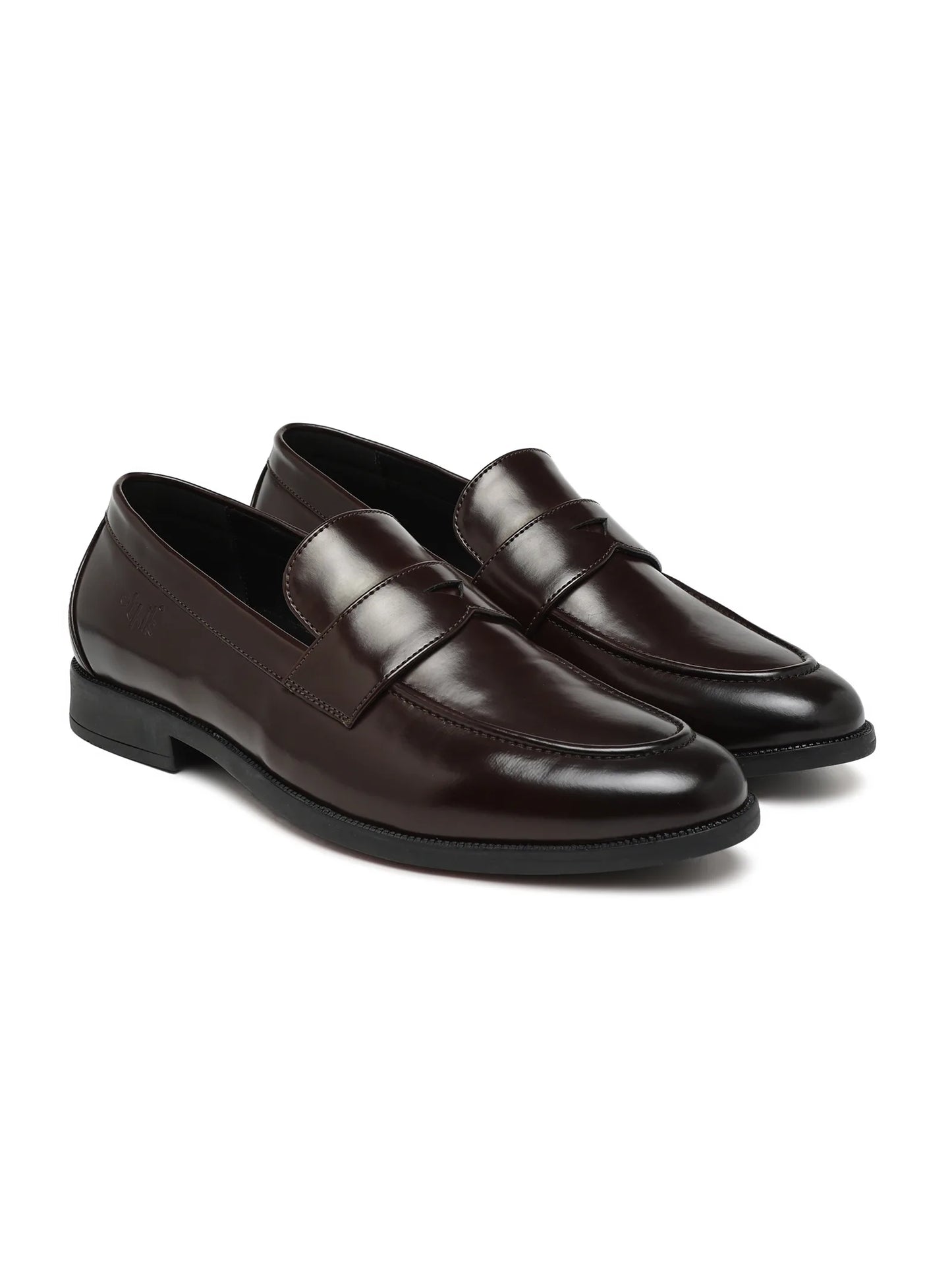 Pair of brown leather loafers on a white background