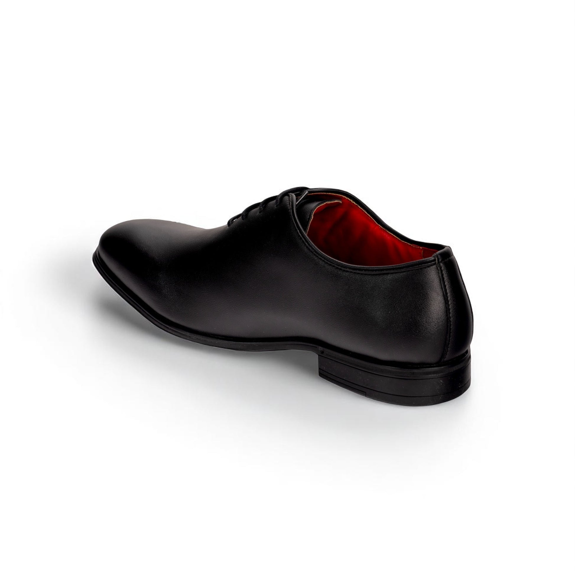 Black leather dress shoe with a red interior on a white background