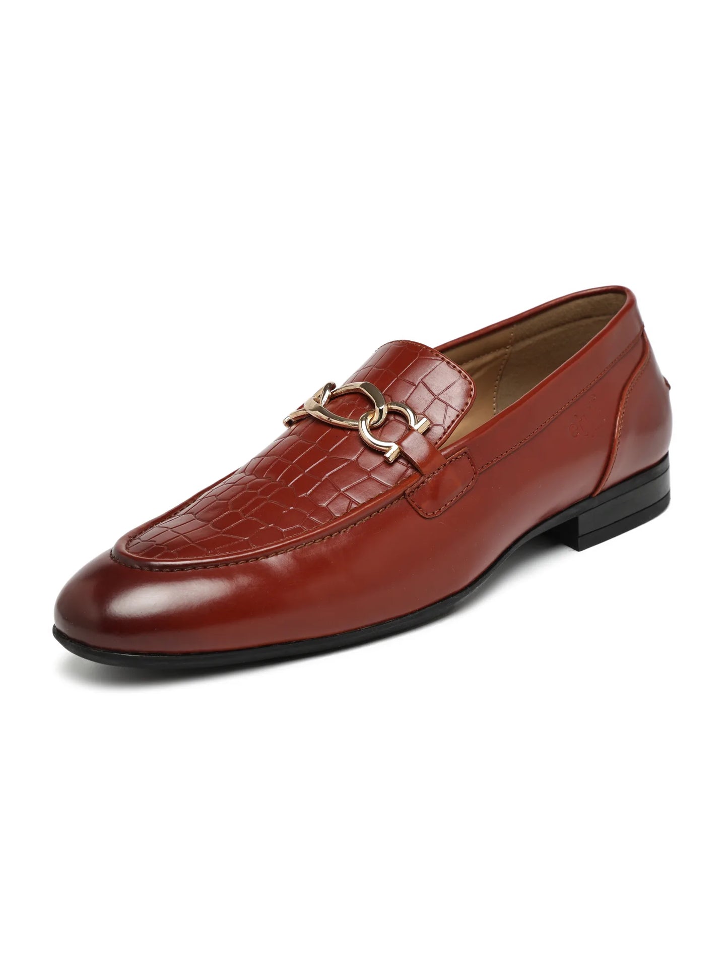 Brown leather loafer with a gold buckle on a white background