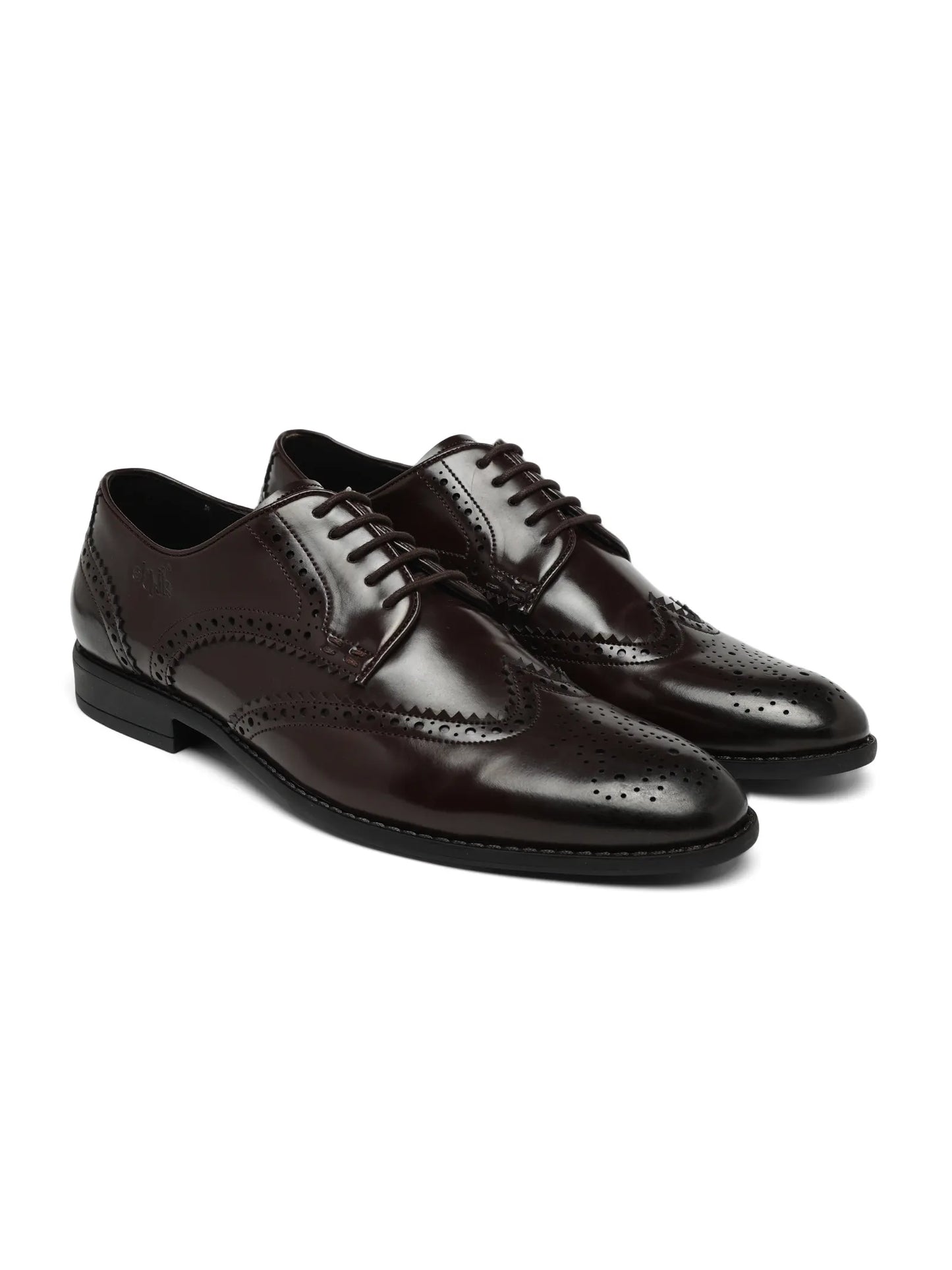 Gray suede and black leather dress shoes on a white background