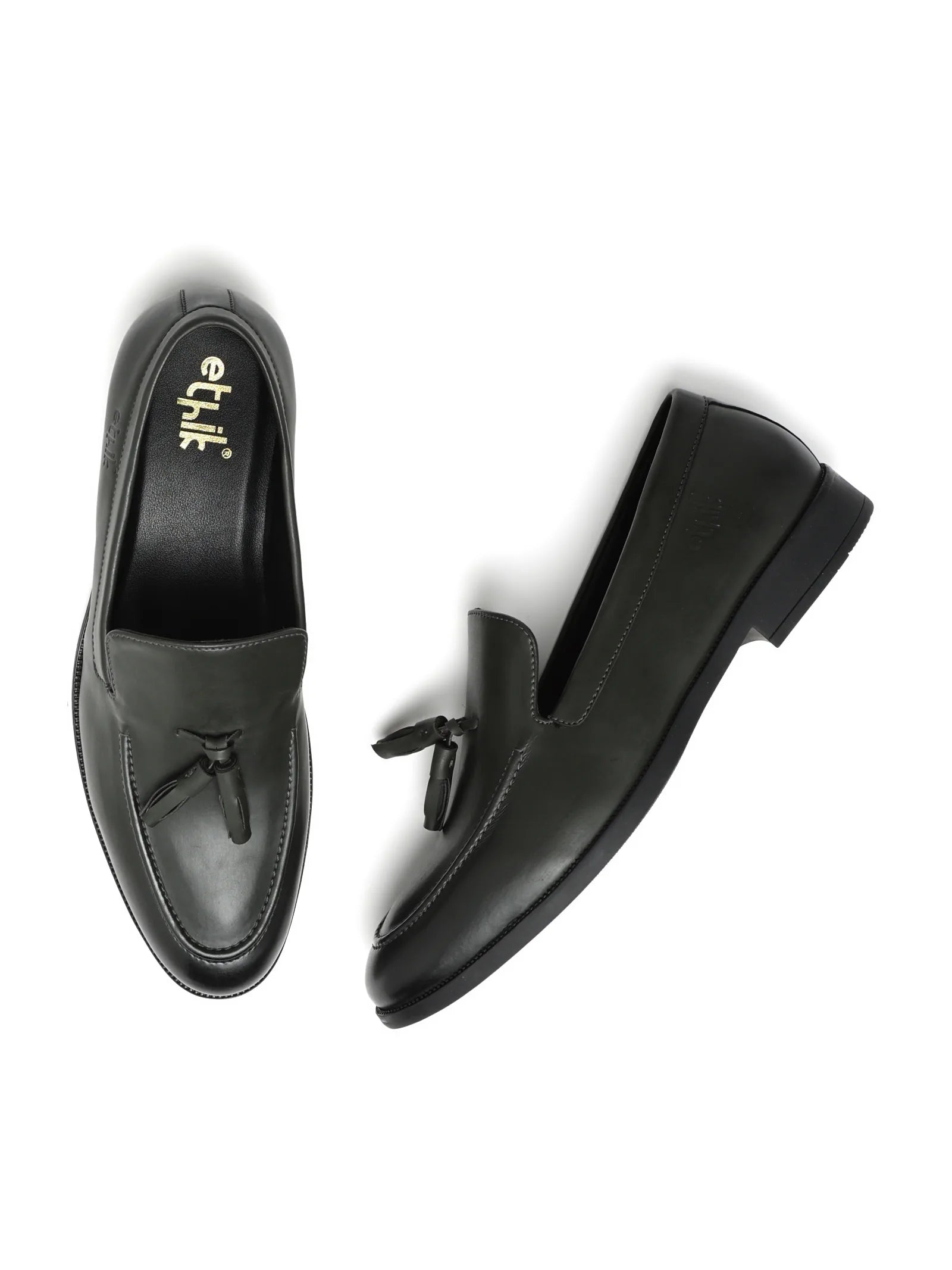 Black loafers with a brand logo on a white background
