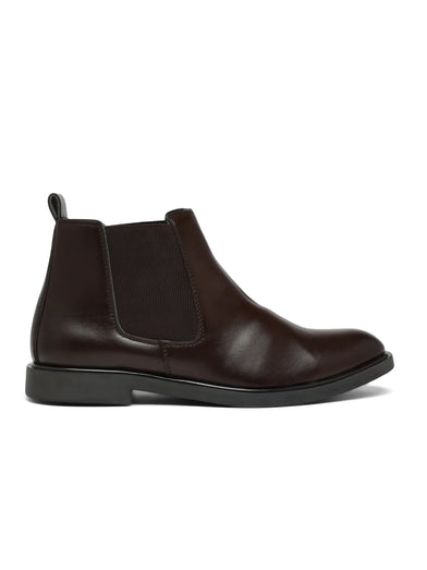 Brown leather Chelsea boot on a white background